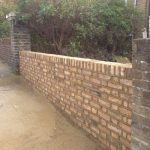 Reconstructed yellow brick wall in a front garden | Bricklayers in London