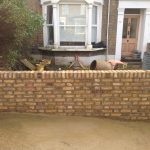 Reconstructed yellow brick wall in a front garden | Bricklayers in London